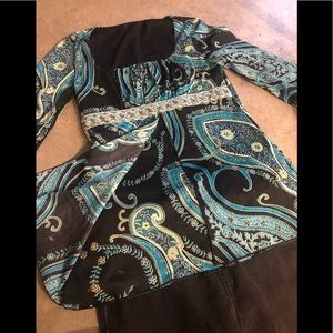 Boho flare sleeved. Detailed with empire waist